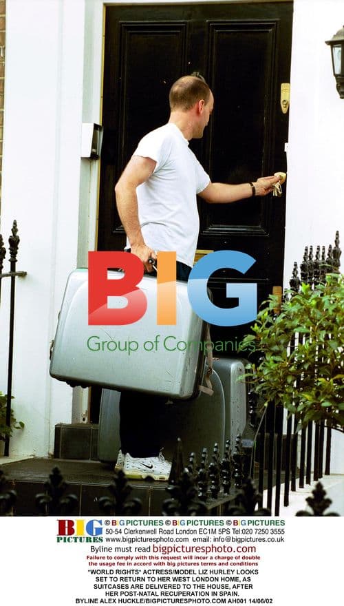 Liz Hurley Returns Home in London