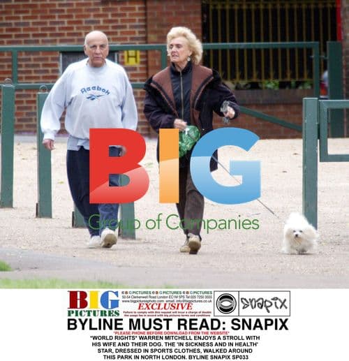 Warren Mitchell enjoys stroll with wife and dog