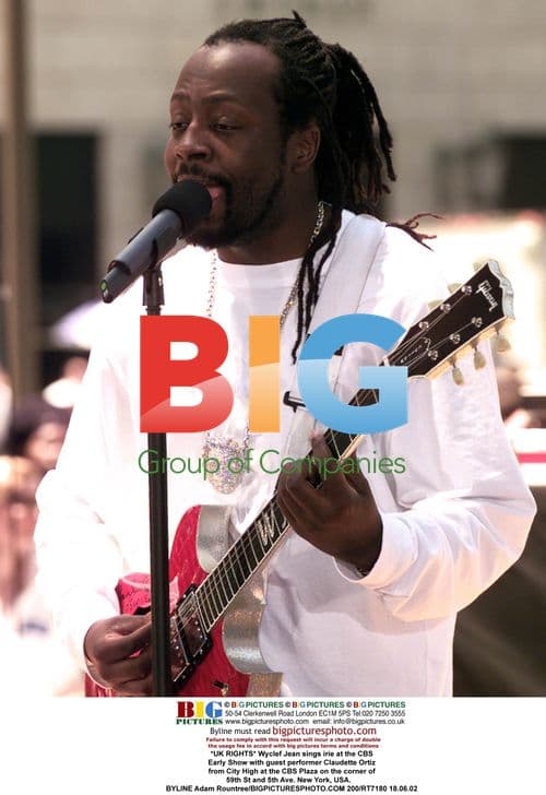 Wyclef Jean performs with Claudette Ortiz at CBS Early Show