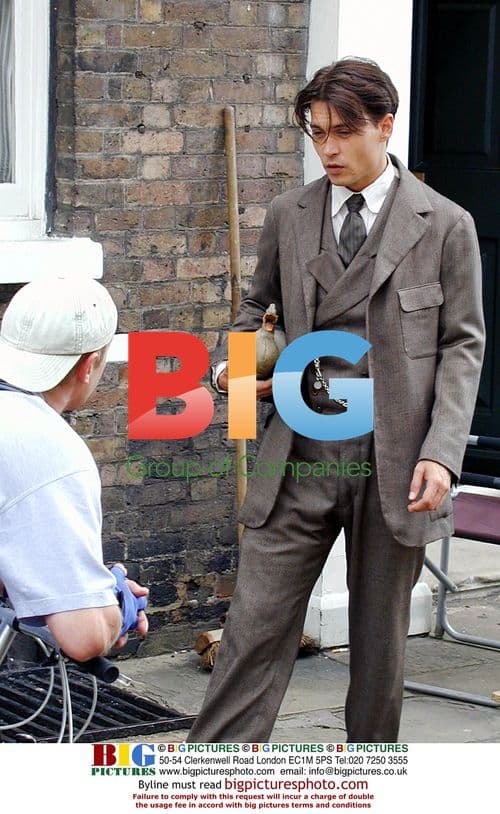 Johnny Depp with duck on 'Neverland' set