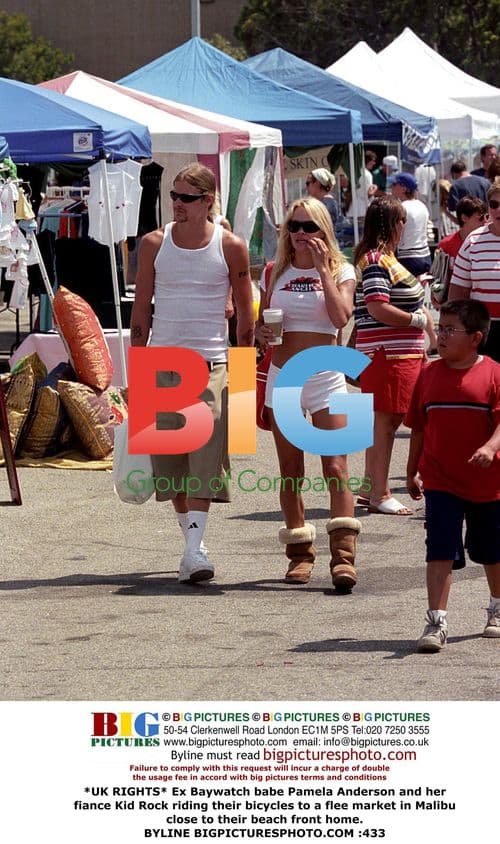 Pamela Anderson and Kid Rock ride bikes in Malibu