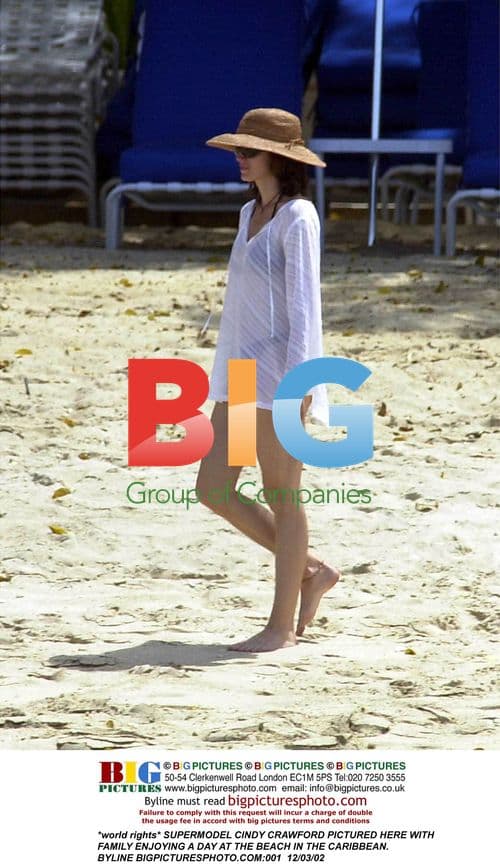 Cindy Crawford Relaxes at Caribbean Beach