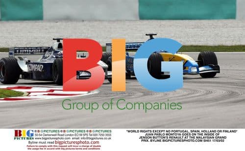 Montoya overtakes Button at Malaysian GP