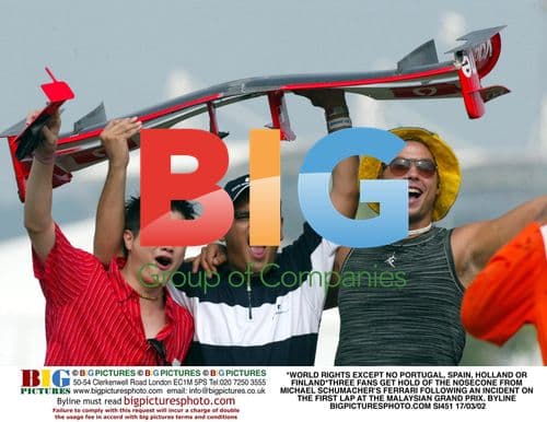 Fans Grab Schumacher's Ferrari Nosecone