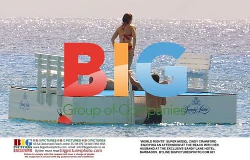 Cindy Crawford and husband at Barbados beach