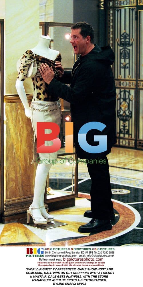 Dale Winton plays with mannequin