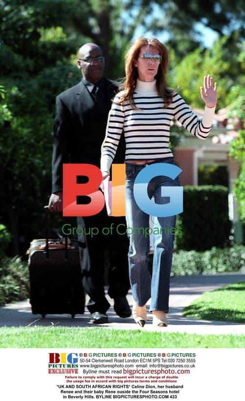 Celine Dion with husband Renee and baby Rene outside Four Seasons