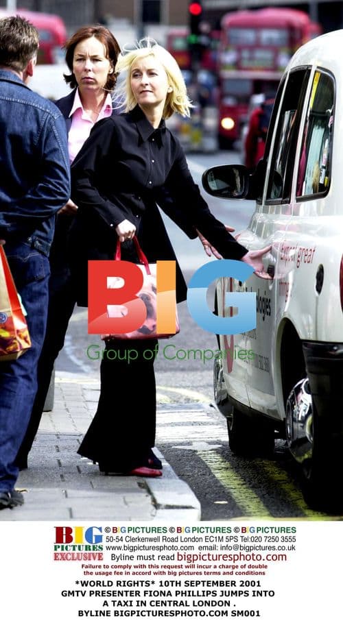 GMTV Presenter Fiona Phillips Hails Taxi in London