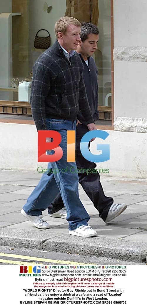Director Guy Ritchie out with friend in London