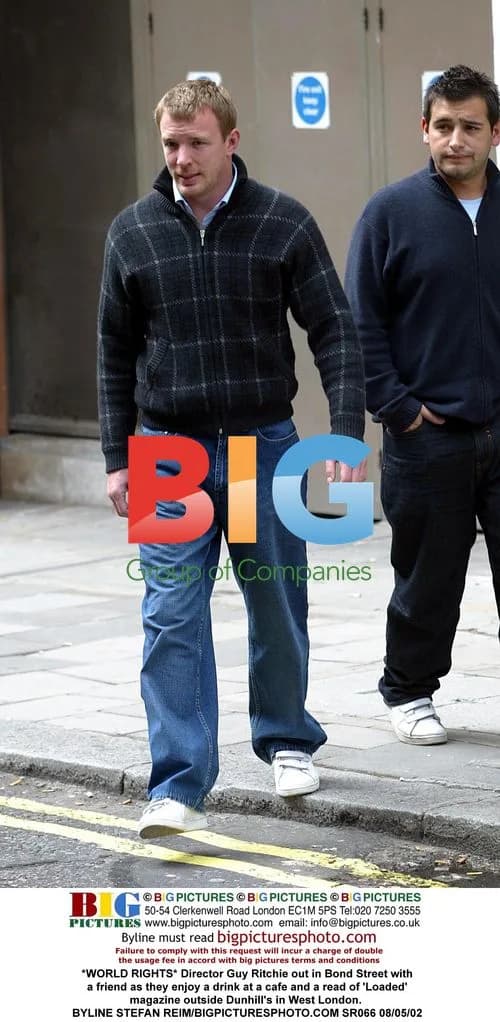 Guy Ritchie enjoys drink and magazine on Bond Street