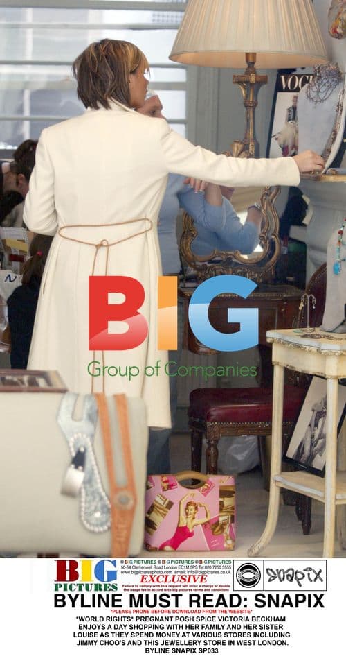 Pregnant Victoria Beckham shops with family