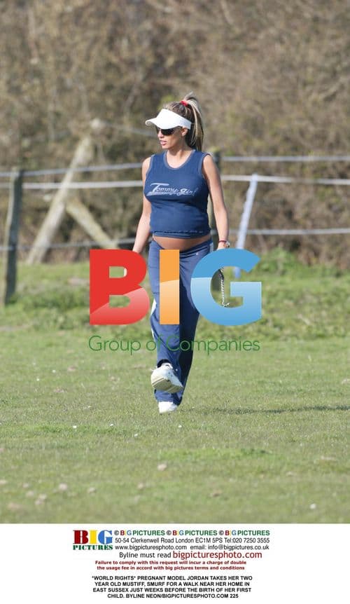 Pregnant model Jordan takes dog for walk
