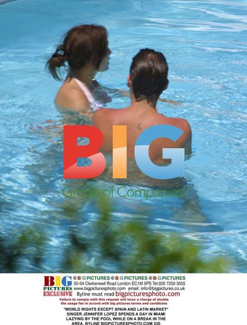 Jennifer Lopez Lounging by Pool in Miami