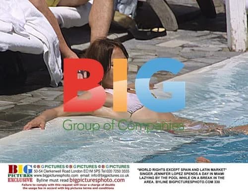Jennifer Lopez Relaxes by Pool in Miami