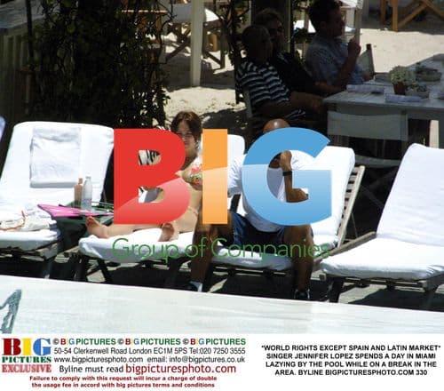 Jennifer Lopez Relaxes by Miami Pool