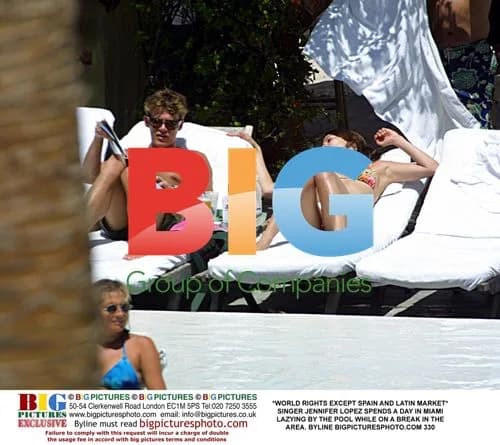 Jennifer Lopez Relaxes by Miami Pool