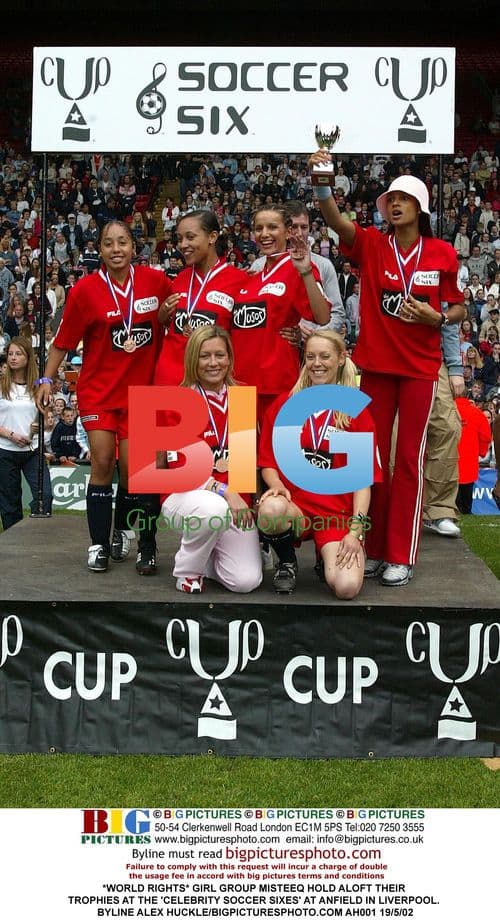 Girl group Misteeq hold trophies at soccer event