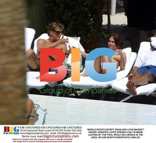 Jennifer Lopez Lounges by Pool in Miami