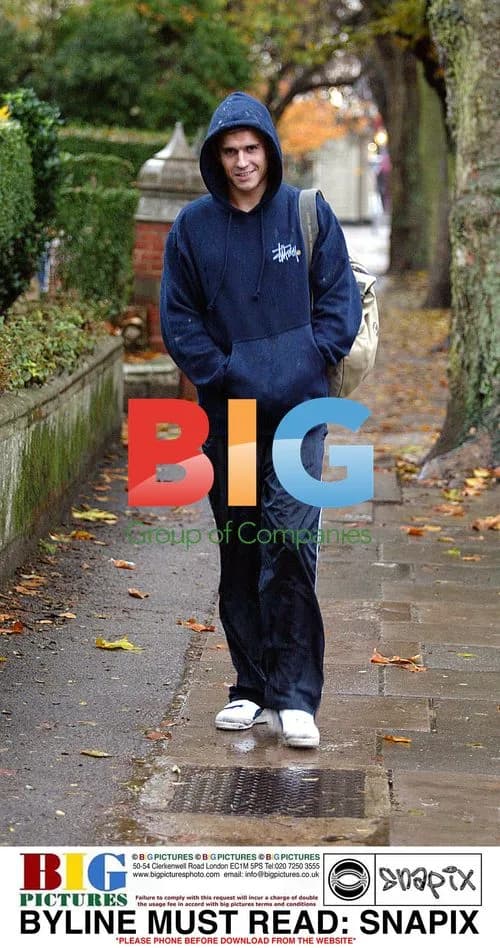 Jeremy Edwards walking in London rain