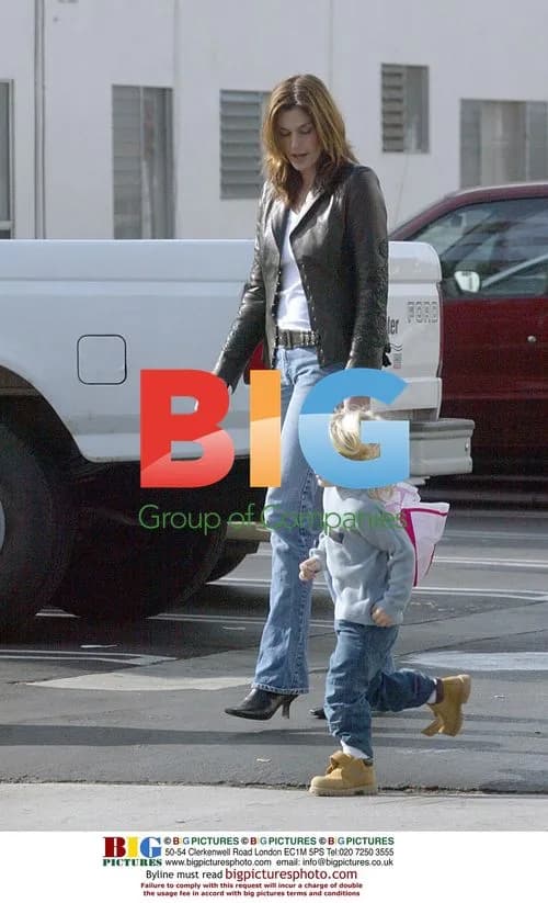 Cindy Crawford and son play with parachute