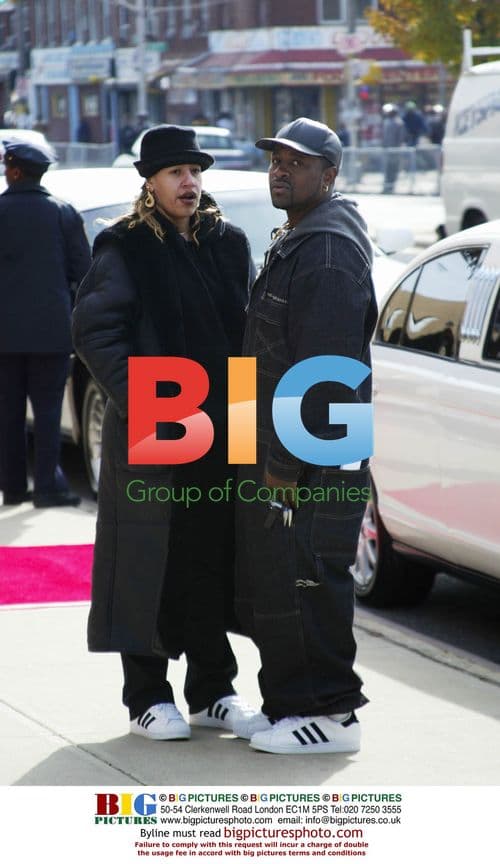 Fans in Run DMC sneakers at Jam Master Jay's funeral