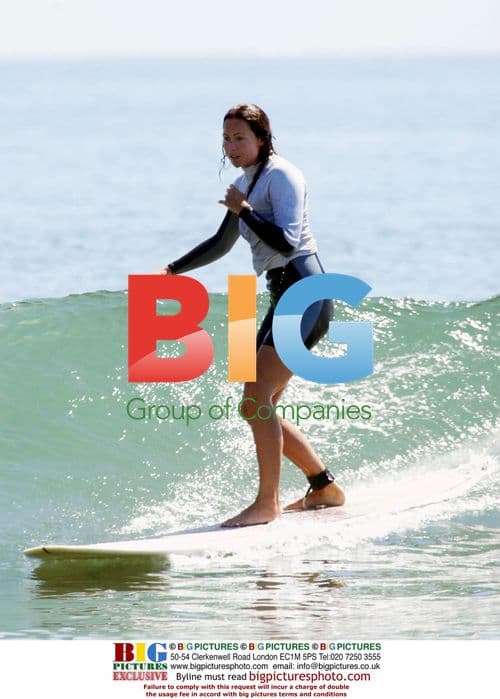 Minnie Driver Surfs in Malibu