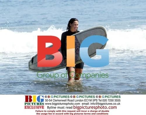 Minnie Driver surfing in Malibu