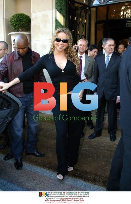 Mariah Carey leaves Paris hotel for album promo
