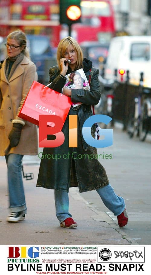Catalina Guirado Waits for Bus in Knightsbridge