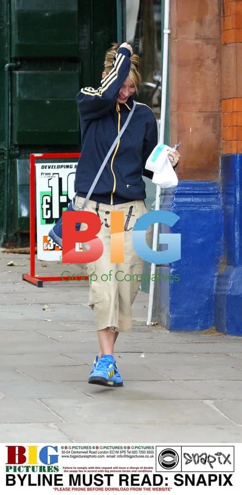 Natalie Appleton Hides from Camera in London
