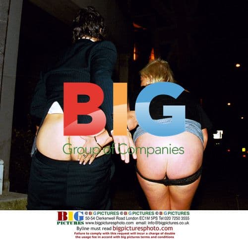 Couple 'Mooning' in Soho, London