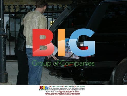 Robbie Williams Receives Water Delivery