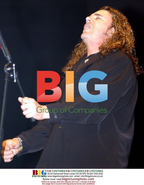 Fher Olvera of Mana performing in San Jose