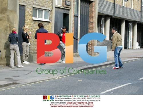 Toby Anstis plays football with friends