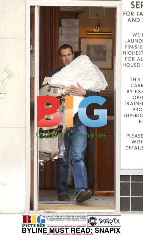 Comedian Johnny Vaughan Doing Laundry