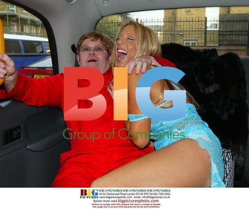 Emma Jones and Elton John Lookalike in Taxi