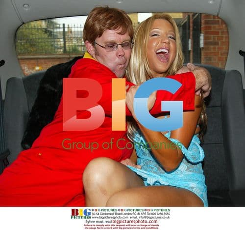 Emma Jones and Elton John Lookalike in Taxi