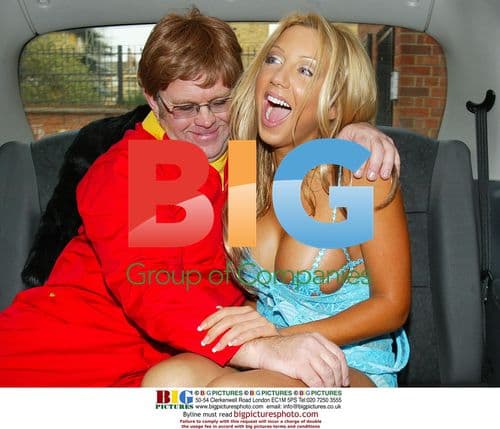Emma Jones and Elton John Lookalike in Taxi