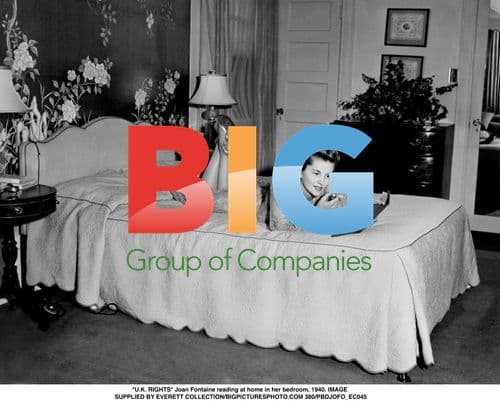 Joan Fontaine reading in bedroom, 1940