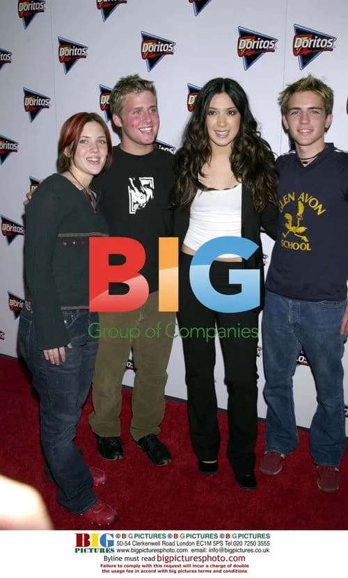 Three stars posing at film premiere