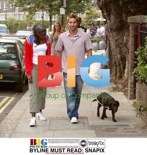 Shaznay Lewis and fiancee Christian walk puppy