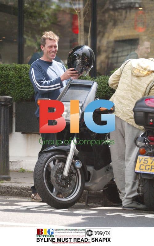 TV Comic Actor Hugh Laurie Rides Bike in London
