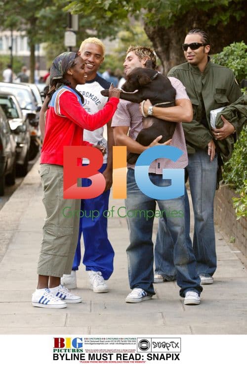 Singer Shaznay Lewis and fiancee on walk with puppy