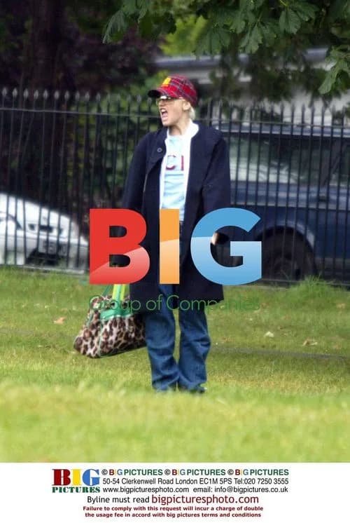 Gwen Stefani plays with dog in London park