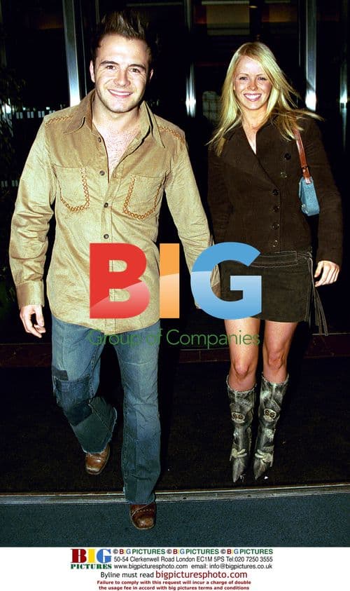 Singer Shane Filan of Westlife with female companion