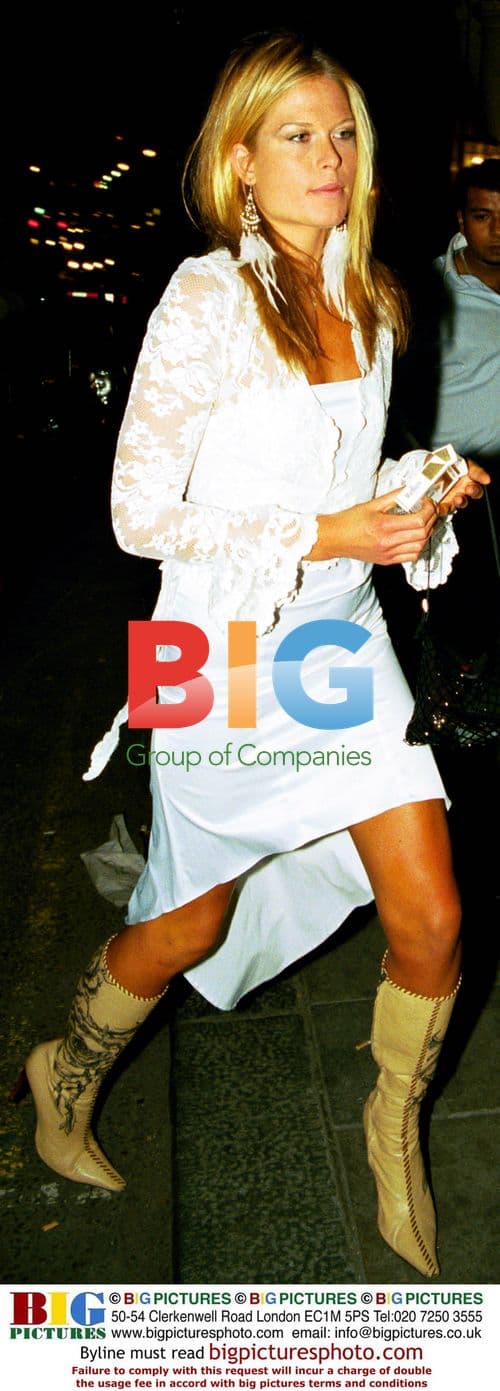 Flavio Briatore and companion leaving club