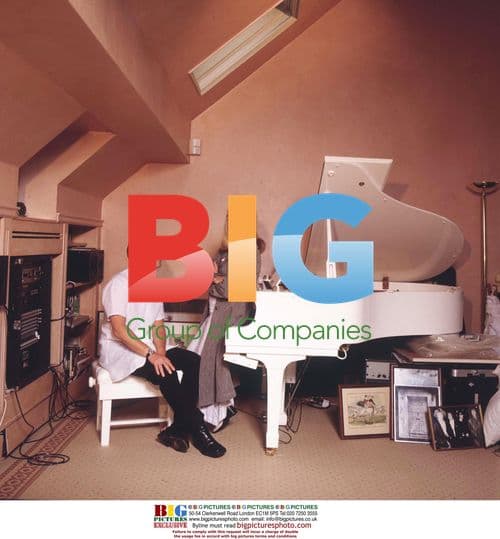 Cynthia and Julian Lennon Pose at Home