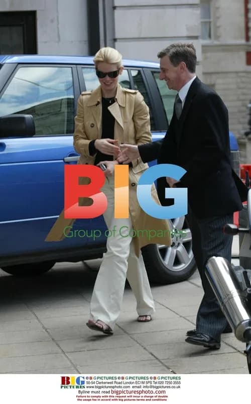 Claudia Schiffer visits bank with husband