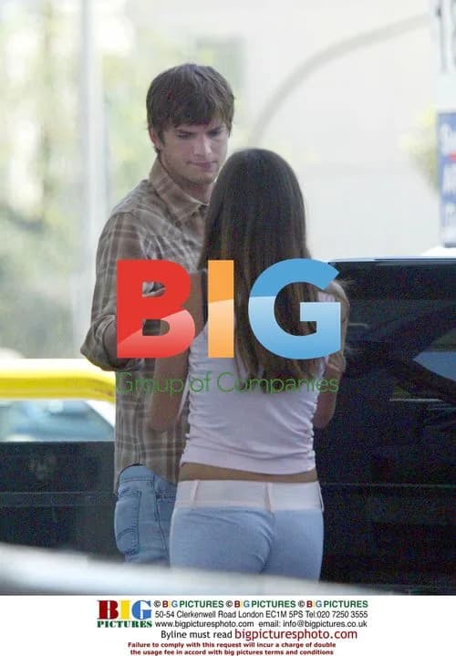 Ashton Kutcher Pumps Gas for Woman