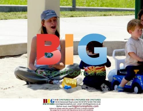 Calista Flockhart with son Liam in sandpit